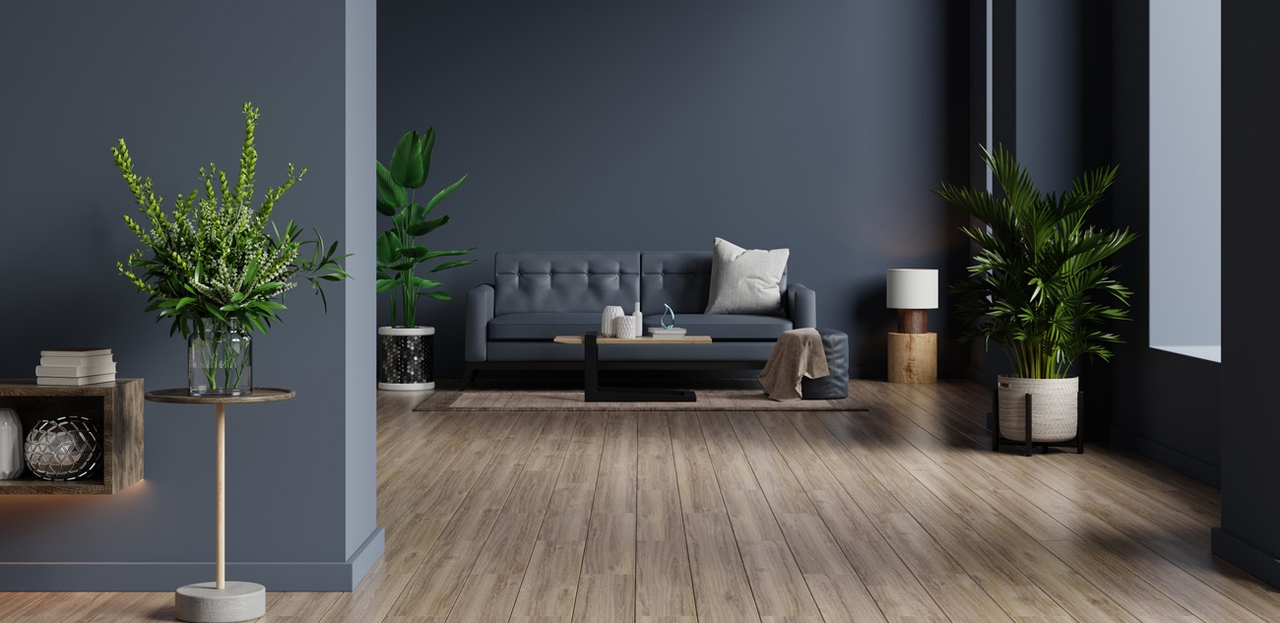 Immagine di un soggiorno con pareti grigie e un divano
