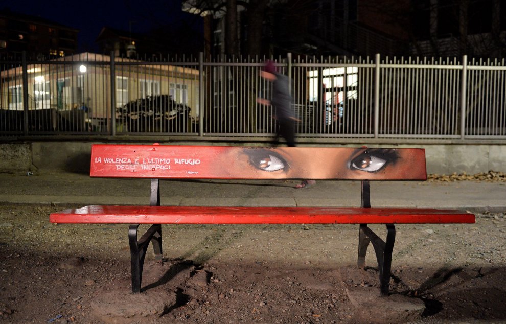 Parco Ruffini, Turin - Drawings by street artist Karim Cherif on a red bench against violence against women