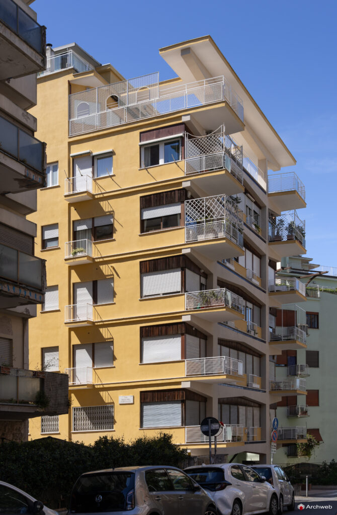 Three-quarter view of the Archimede building in the context of Via Archimede