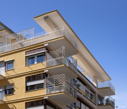 Side detail of the balconies and the connection to the sky of the Cassiopea building on Via Archimede