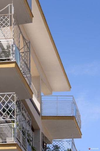 Side detail of the balconies and the connection to the sky of the Cassiopea building on Via Archimede