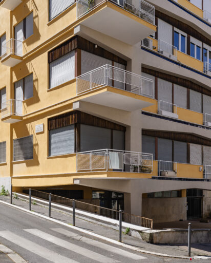 Detail of the corner of the Cassiopea building at the intersection of Via Archimede and Via Barnaba Tortolini