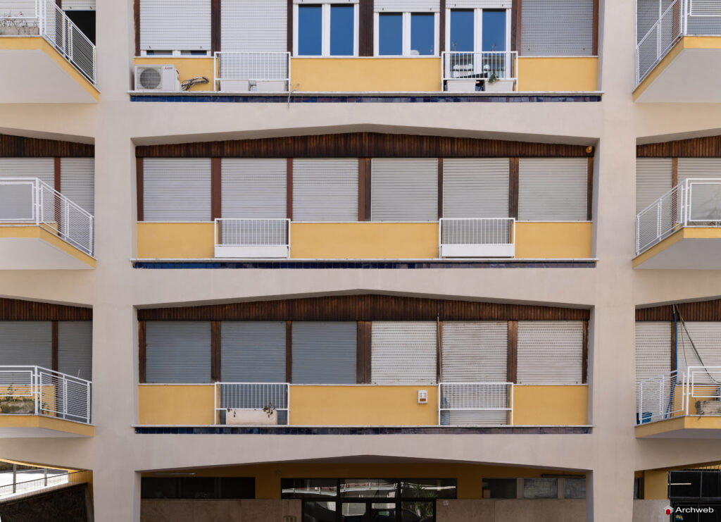 Detail of the main facade of the Cassiopea building seen from Via Archimede