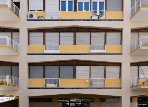Detail of the main facade of the Cassiopea building seen from Via Archimede