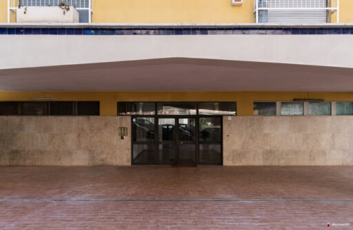 Main entrance of the Cassiopea building seen from Via Archimede