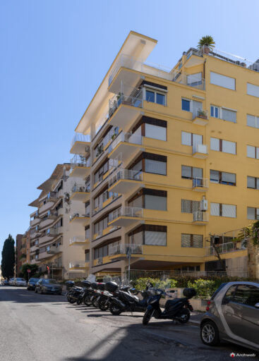 Three-quarter view of the Cassiopea building on Via Archimede