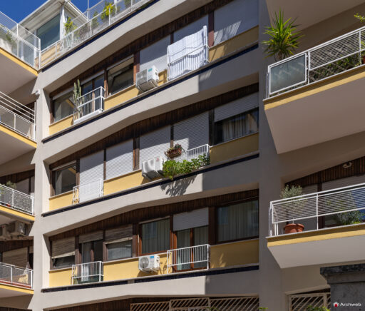 Detail of the rear facade of the Cassiopea building; three-quarter view from Via Barnaba Tortolini
